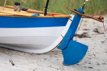 Fishing boat on the beach in the morning. Close-up