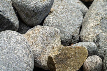 round rocks and pebbles on the beach in australiaの写真素材