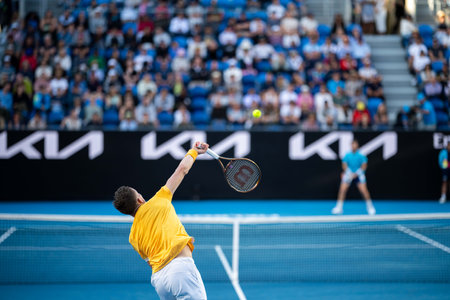 Tennis player playing on a court in a tennis tournament in summer