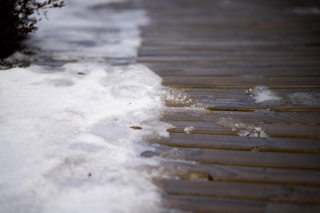 snow on a boardwalk in a national park in australiaの写真素材