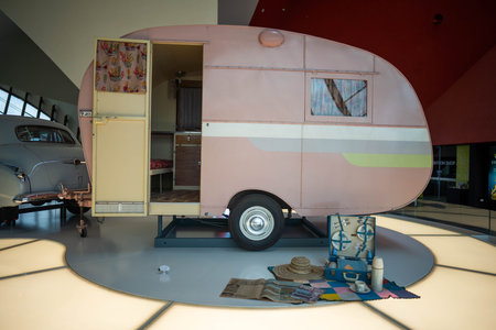 vintage silver car and caravan in a show