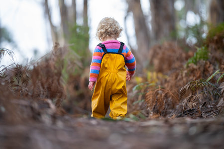 child exploring in the wild trees in englandの写真素材