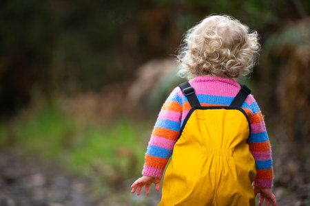 toddler walking on a hike in a park in australiaの写真素材