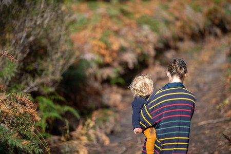 mother and baby hiking in the forest in springの写真素材