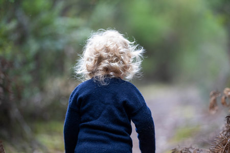 baby running down a path in the bush in americaの写真素材