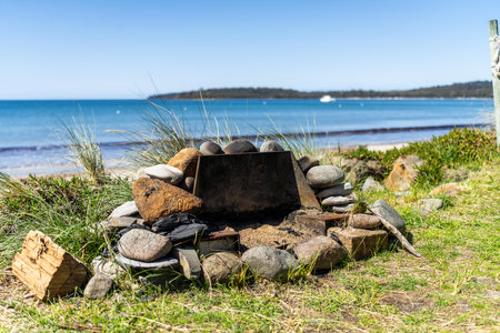 beach fire pit on the sand at a holiday house in summerの写真素材