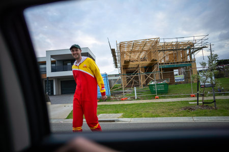 View from the car window of a young man in a construction site