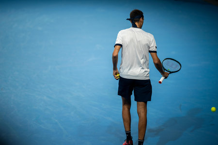 female Professional athlete Tennis player playing on a court in a tennis tournament in summerの写真素材