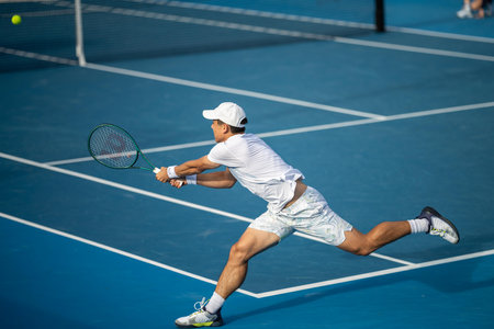 playing tennis at a tournament and match