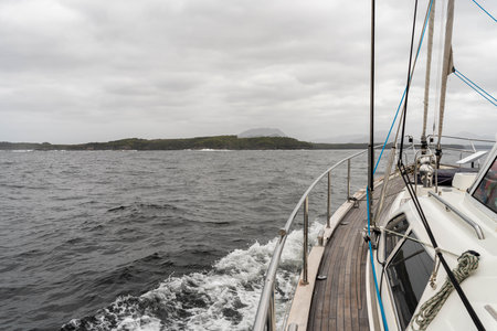 sailing on a yacht in the australian in the remote forest wilderness in spring in australiaの写真素材