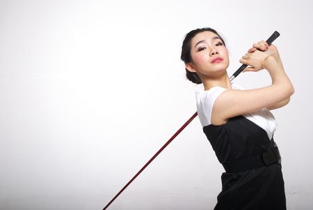 Asian woman golfingの写真素材