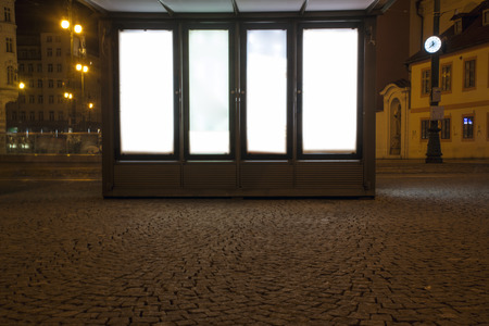 billboard at bus stop during nightの写真素材