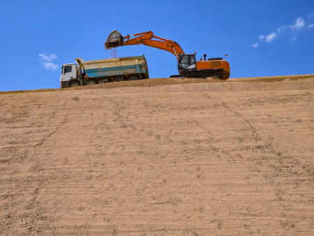 Clay cover construction process in sanitary landfills using heavy machinery.の写真素材