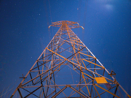 High voltage tower in long exposure night photography.の写真素材