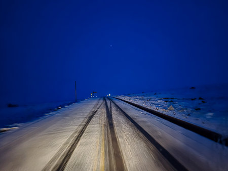 Roads in high Andean landscapes with snow and high-voltage towers.の写真素材