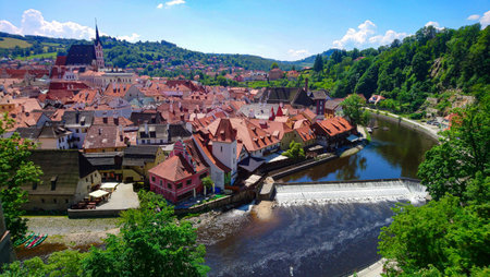 Panoramic view of a European city amidst forests and riversの写真素材