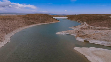 Water reservoir retained by a concrete dam in the high Andesの写真素材
