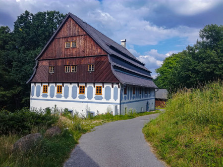 House with medieval architecture built with wood next to the roadの写真素材