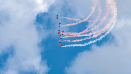 Sports planes flying and releasing colored smoke at the festivalの写真素材