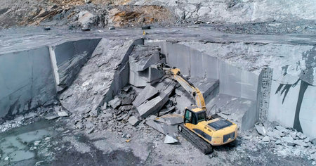 Mining machinery extracting ornamental rock in a quarryの写真素材