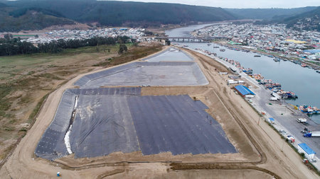 Geomembrane deployment and installation process with machinery in the construction of water poolsの写真素材