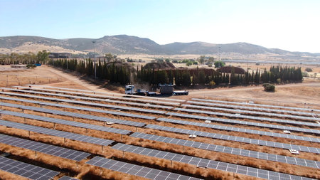 Installation process of solar panel banks with machinery