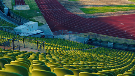 Interior view of a stadium with plenty of seating and sports areas