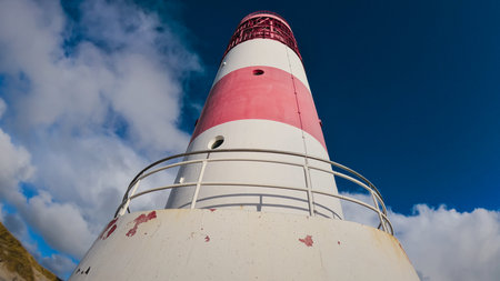 View of a maritime lighthouse located on a cliff to guide merchant vesselsの写真素材