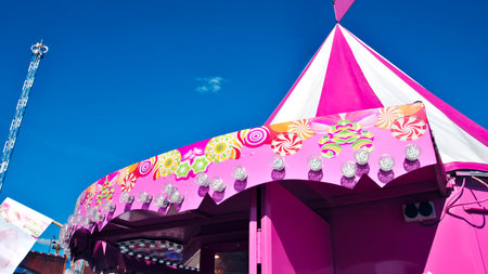 View of tents and fairgrounds for festive events with vivid colors and lots of lights ready to be...