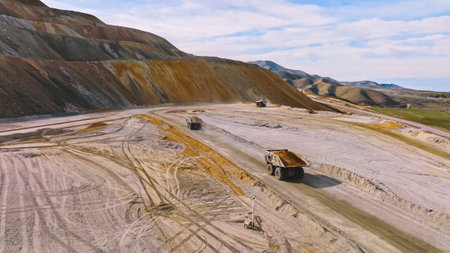 Process of transporting and dumping excavated mine material into leaching pads