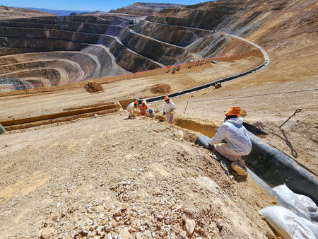 Construction process of storm drains with HDPE geomembrane on open-pit mine slopes and sidewalks