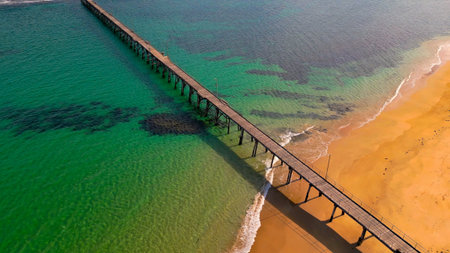 View of a wooden pier on a paradise beach to avoid contact with the sandの写真素材