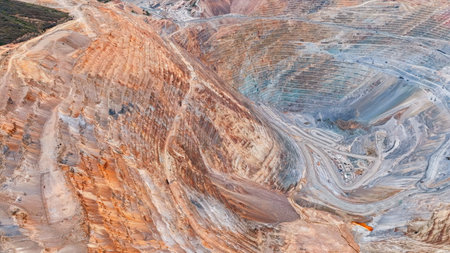Aerial view of an open-pit mine with closed and remediated benches and mineral extraction platformsの写真素材