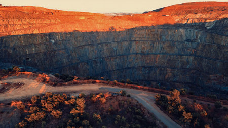 View of a huge open pit mine in rocky terrainの写真素材