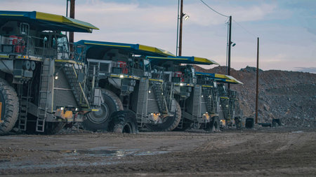 View of a huge parking lot of mining trucks awaiting the changing of the guard