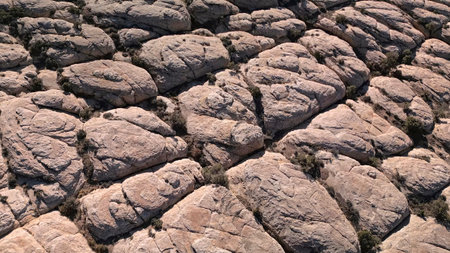 Aerial view of geological formations of granite rock with copper ore inclusions