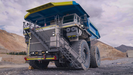 Huge mining truck parked during operator change or shift change for work in the mine