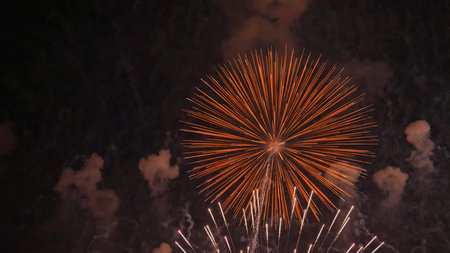 Sky view with enormous fireworks of multiple shapes and colors at festivals