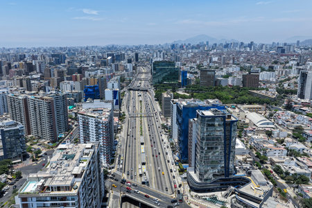 Aerial view of an overpopulated city next to highways with heavy vehicular trafficの写真素材