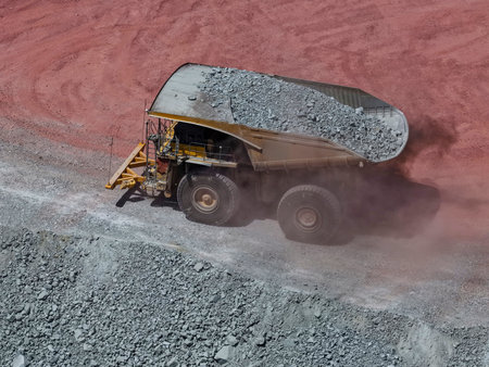 Mineral transport process from the bottom of the mine using huge mining dump trucks to the...