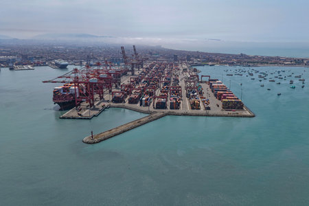 Panoramic view of a huge port terminal for container ships with a rock breakwater