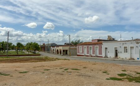 Urban street of Gibara, with colored facades and the blue slky at the medium dayのeditorial素材