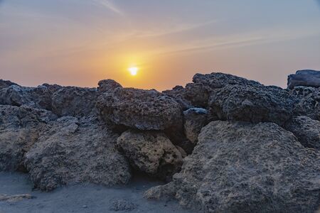 Sunset on the rocksの写真素材