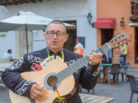 Street musician of mexican music style in the streets of Cartagena de Indias at the morningのeditorial素材