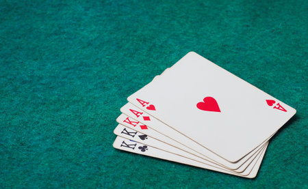 Playing Card on Green Table In Casino, four of a kind cardの写真素材