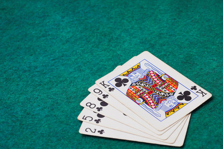 Playing Card on Green Table In Casino, Flush cardの写真素材