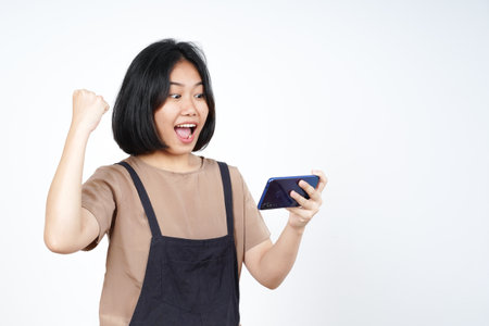 Playing Mobile Game on Smartphone of Beautiful Asian Woman Isolated On White Backgroundの写真素材