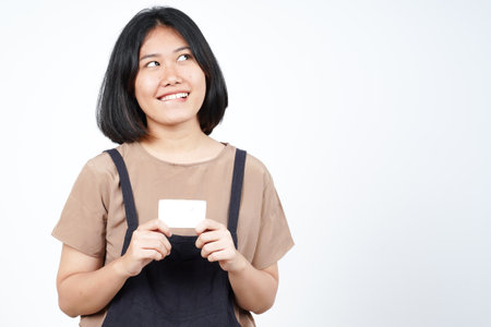 Holding Blank Bank Card Or Credit Card of Beautiful Asian Woman Isolated On White Backgroundの写真素材