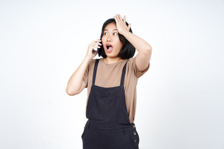 Talking on the smartphone and forget something of Beautiful Asian Woman Isolated On White Backgroundの写真素材