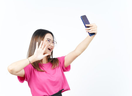 Take a Selfie using Smartphone Of Beautiful Asian Woman Isolated On White Backgroundの写真素材